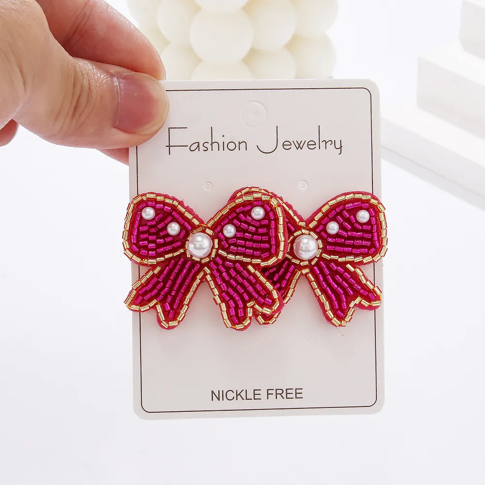 1 Pair Casual Elegant Simple Style Bow Knot Inlay Beaded Seed Bead Artificial Pearls Ear Studs