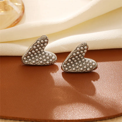 1 Pair Casual Retro Geometric Heart Shape Bow Knot Hollow Out Inlay Titanium Steel Pearl Zircon Earrings