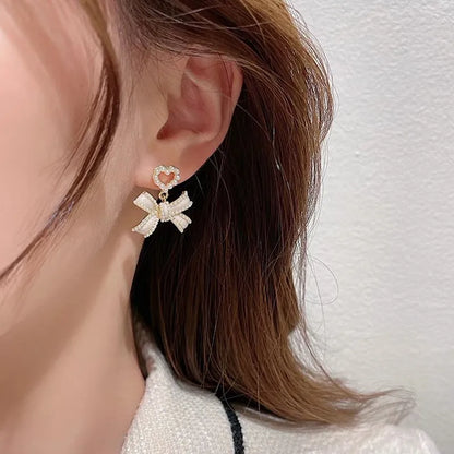 1 Pair Elegant Classic Style Streetwear Bow Knot Inlay Alloy Artificial Pearls Drop Earrings