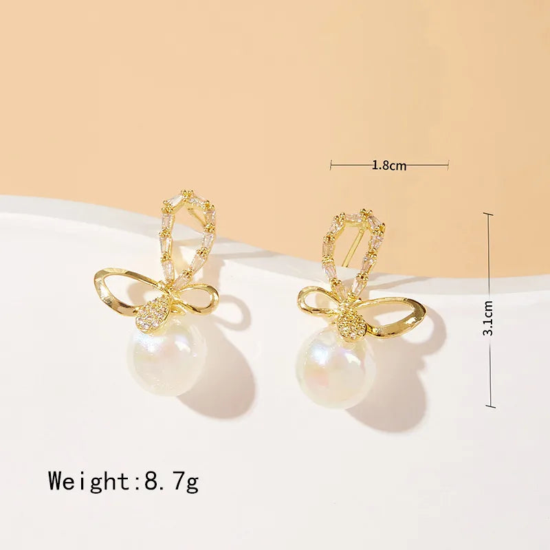 1 Pair Elegant Simple Style Bow Knot Inlay Alloy Artificial Pearls Zircon Drop Earrings