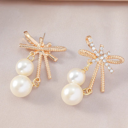 1 Pair Elegant Streetwear Bow Knot Inlay Alloy Artificial Pearls Gold Plated Drop Earrings