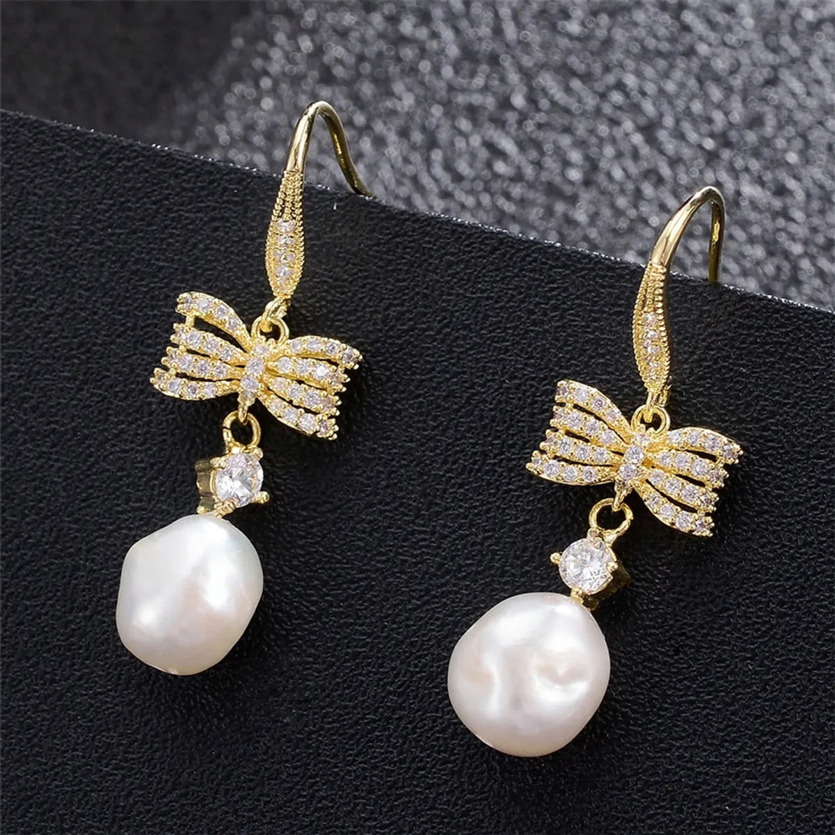 1 Pair Elegant Vacation Shiny Irregular Bow Knot Plating Inlay Copper Freshwater Pearl Zircon Drop Earrings