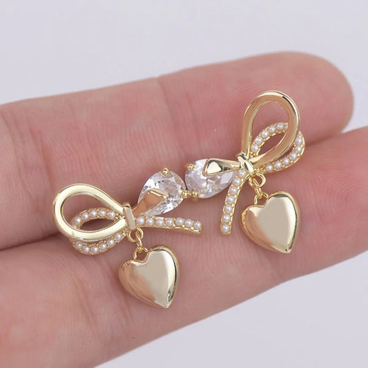 1 Pair Fairy Style French Style Simple Style Heart Shape Bow Knot Plating Inlay Copper Artificial Pearls Zircon 14k Gold Plated Ear Studs