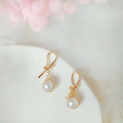 1 Pair Fashion Flower Butterfly Bow Knot Alloy Inlay Artificial Pearls Rhinestones Shell Women'S Earrings