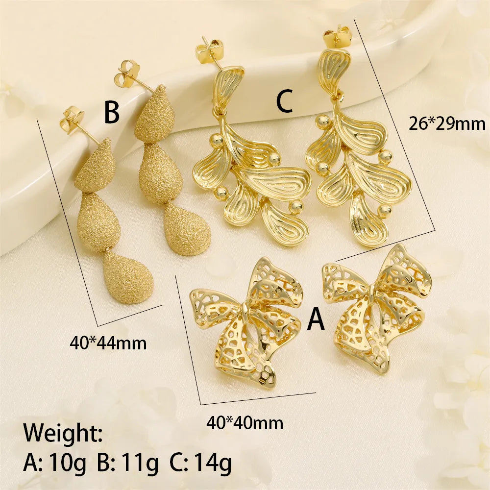 1 Pair IG Style Exaggerated Streetwear Water Droplets Bow Knot Three-Dimensional Copper 18K Gold Plated Drop Earrings Ear Studs