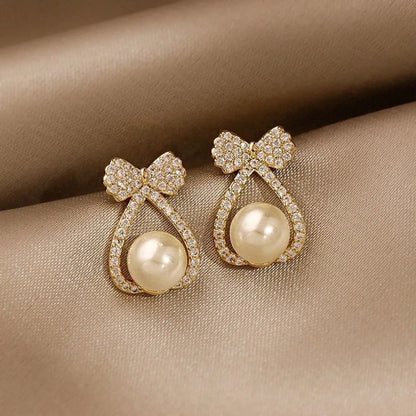 1 Pair IG Style Simple Style Heart Shape Flower Bow Knot Inlay Alloy Artificial Pearls Rhinestones Drop Earrings Earrings Ear Studs