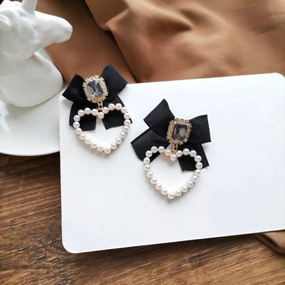 1 Pair Retro Heart Shape Alloy Inlay Artificial Gemstones Artificial Pearls Women'S Drop Earrings