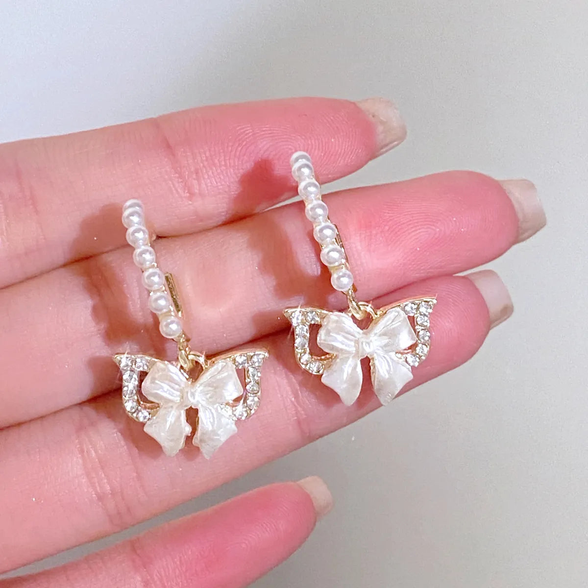 1 Pair Simple Style Classic Style Bow Knot Inlay Alloy Rhinestones Drop Earrings