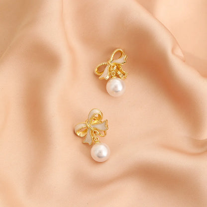 1 Pair Simple Style Classic Style Bow Knot Plating Alloy Zinc Alloy Drop Earrings