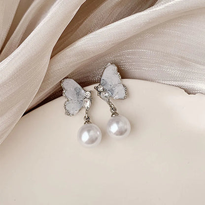 1 Pair Simple Style Classic Style Wings Plating Inlay Alloy Artificial Rhinestones Artificial Pearls White Gold Plated Drop Earrings