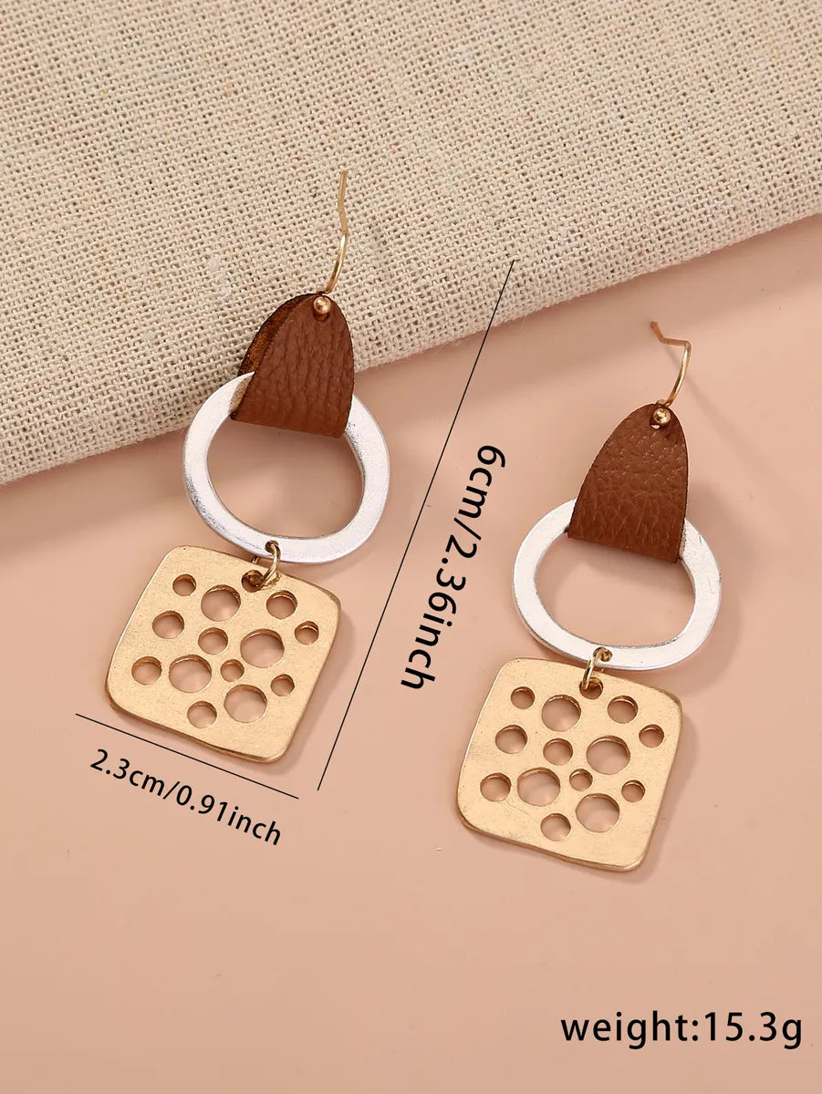 1 Pair Simple Style Commute Color Block Irregular Hollow Out Pu Leather Drop Earrings