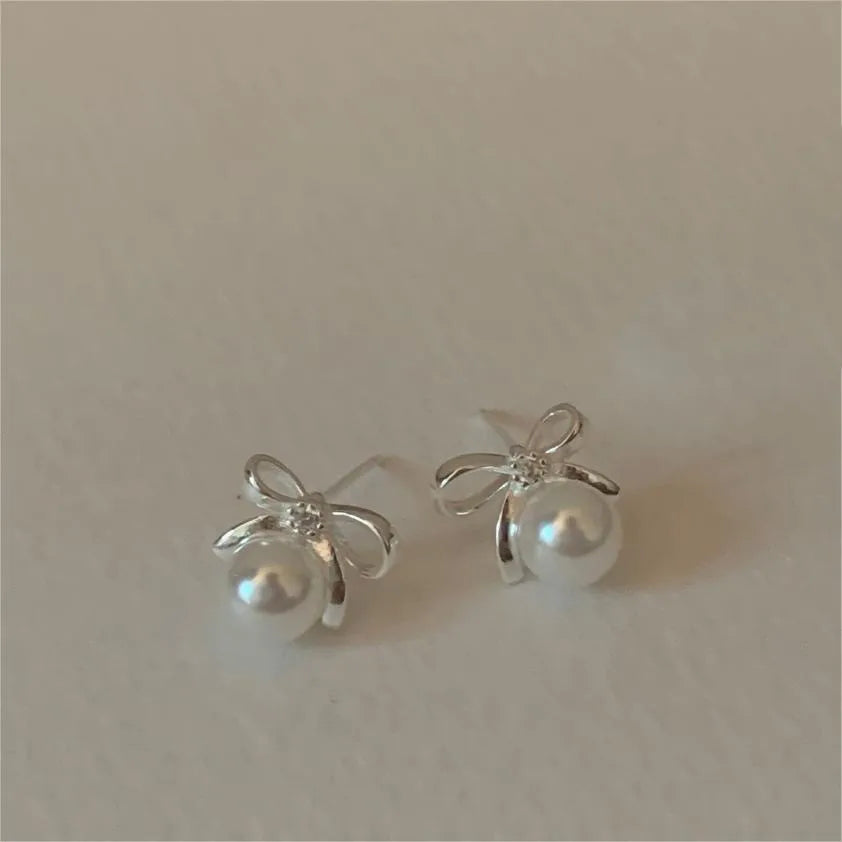 1 Pair Sweet Simple Style Bow Knot Inlay Sterling Silver Pearl Zircon Ear Studs