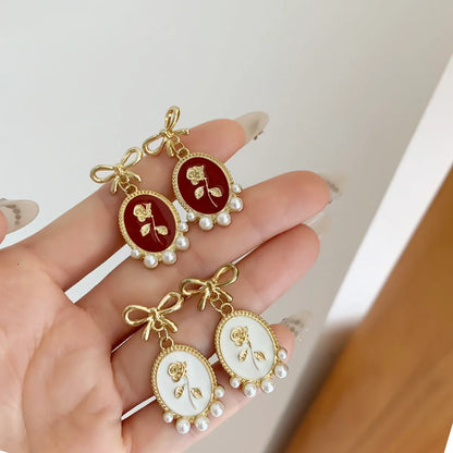 1 Pair Vintage Style Bow Knot Enamel Plating Inlay Alloy Artificial Pearls Gold Plated Drop Earrings