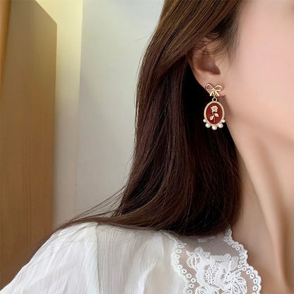 1 Pair Vintage Style Bow Knot Enamel Plating Inlay Alloy Artificial Pearls Gold Plated Drop Earrings