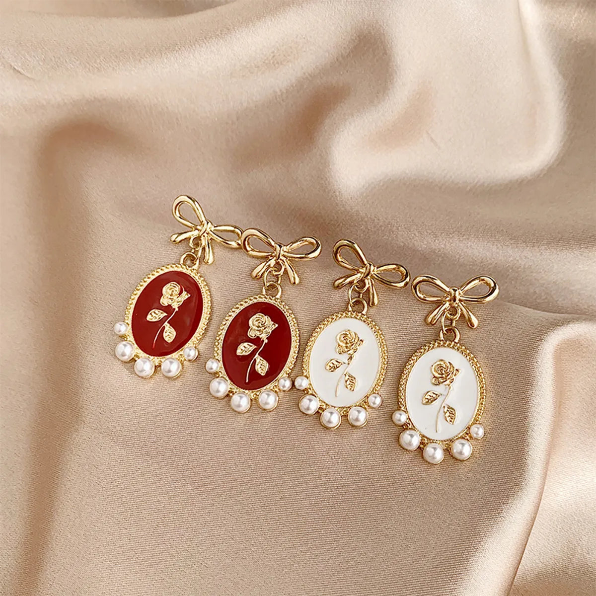 1 Pair Vintage Style Bow Knot Enamel Plating Inlay Alloy Artificial Pearls Gold Plated Drop Earrings