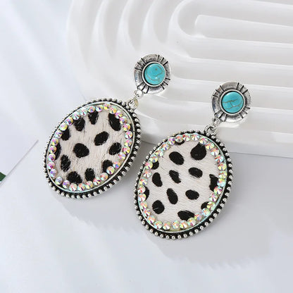 1 Pair Vintage Style Simple Style Oval Leopard Plating Inlay Pu Leather Alloy Turquoise Rhinestones Silver Plated Drop Earrings