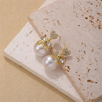 1 Piece Simple Style Heart Shape Bow Knot Plating Inlay Copper Pearl Zircon Gold Plated Ear Studs