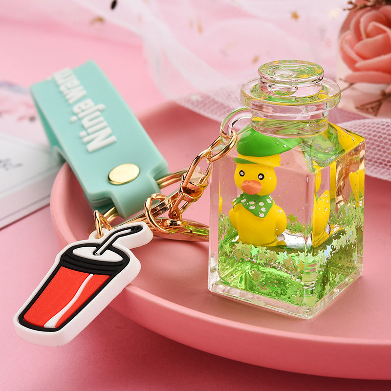 Cute Quicksand Little Yellow Duck Dinosaur Perfume Bottle Acrylic Keychain Wholesale Nihaojewelry