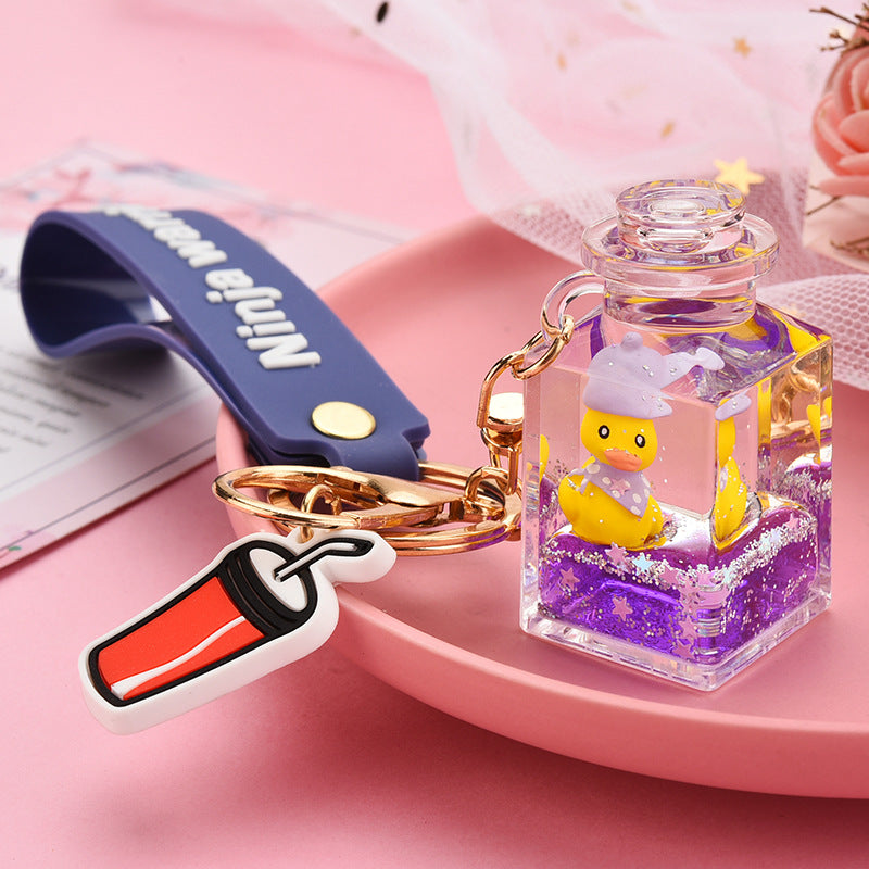 Cute Quicksand Little Yellow Duck Dinosaur Perfume Bottle Acrylic Keychain Wholesale Nihaojewelry