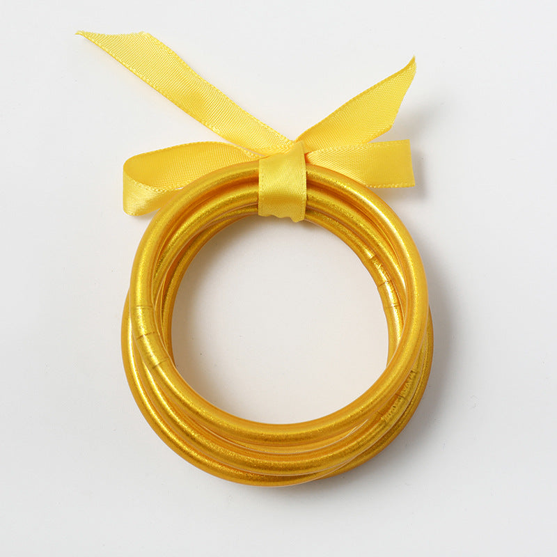 Casual Simple Style Solid Color Bow Knot Plastic Silica Gel Gold Foil Women's Wristband