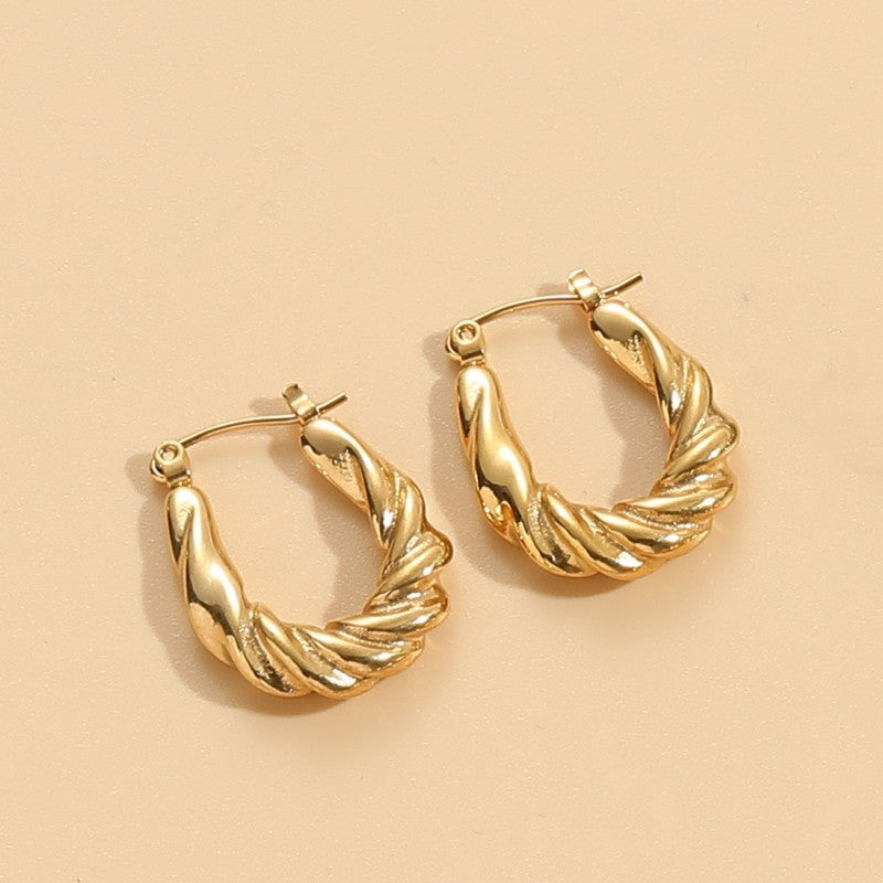 1 Pair Elegant Classic Style Stripe Oval Twist Hollow Out Titanium Steel Earrings