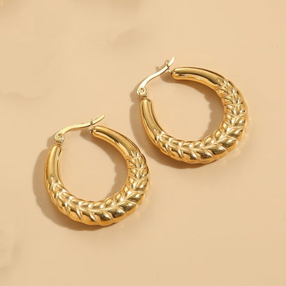 1 Pair Elegant Classic Style Stripe Oval Twist Hollow Out Titanium Steel Earrings