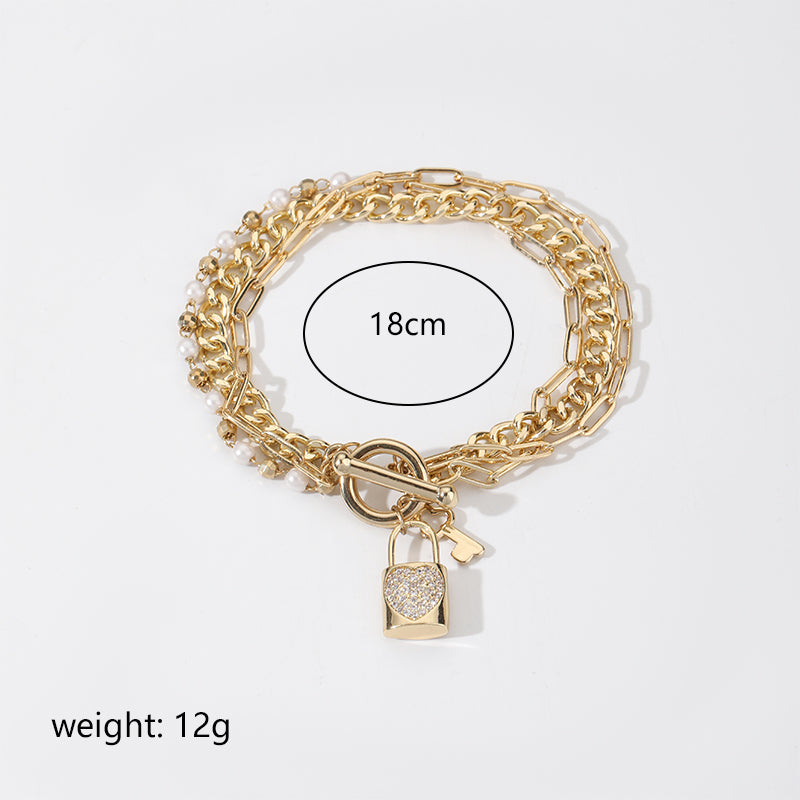 Simple Style Key Lock Copper Toggle Plating Inlay Artificial Pearls Zircon 18k Gold Plated Silver Plated Bracelets