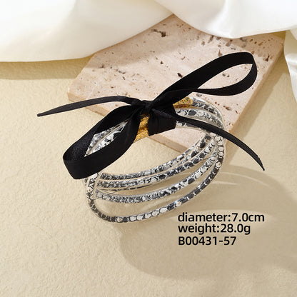 Elegant Simple Style Printing Bow Knot Silica Gel Braid Appliques Women's Bangle