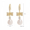 1 Pair Elegant Vacation Shiny Irregular Bow Knot Plating Inlay Copper Freshwater Pearl Zircon Drop Earrings