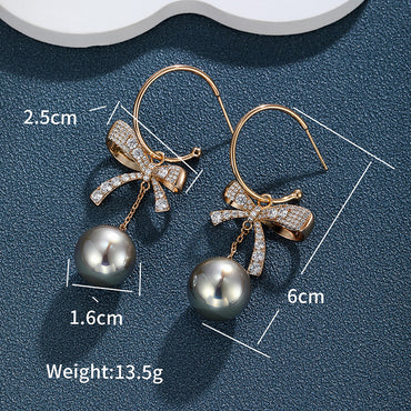 1 Pair Elegant Glam XUPING Bow Knot Inlay Alloy Copper Alloy Artificial Gemstones Artificial Pearls 18K Gold Plated Drop Earrings