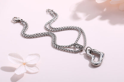 Personality Multi-layer Pearl Chain Heart-shaped Hollow Pendant Stainless Steel Bracelet Wholesale