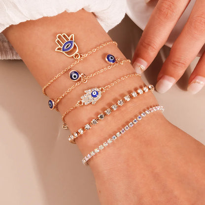 Casual Modern Style Devil'S Eye Palm Zinc Alloy Enamel Hollow Out Inlay Rhinestones Women'S Bracelets