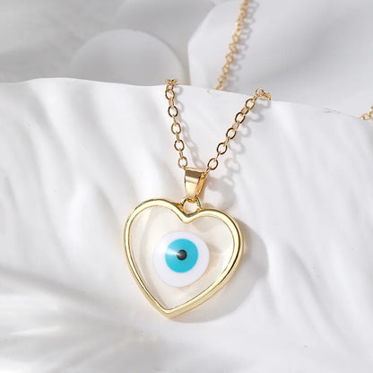 Casual Simple Style Heart Shape Eye Alloy Resin Women'S Pendant Necklace