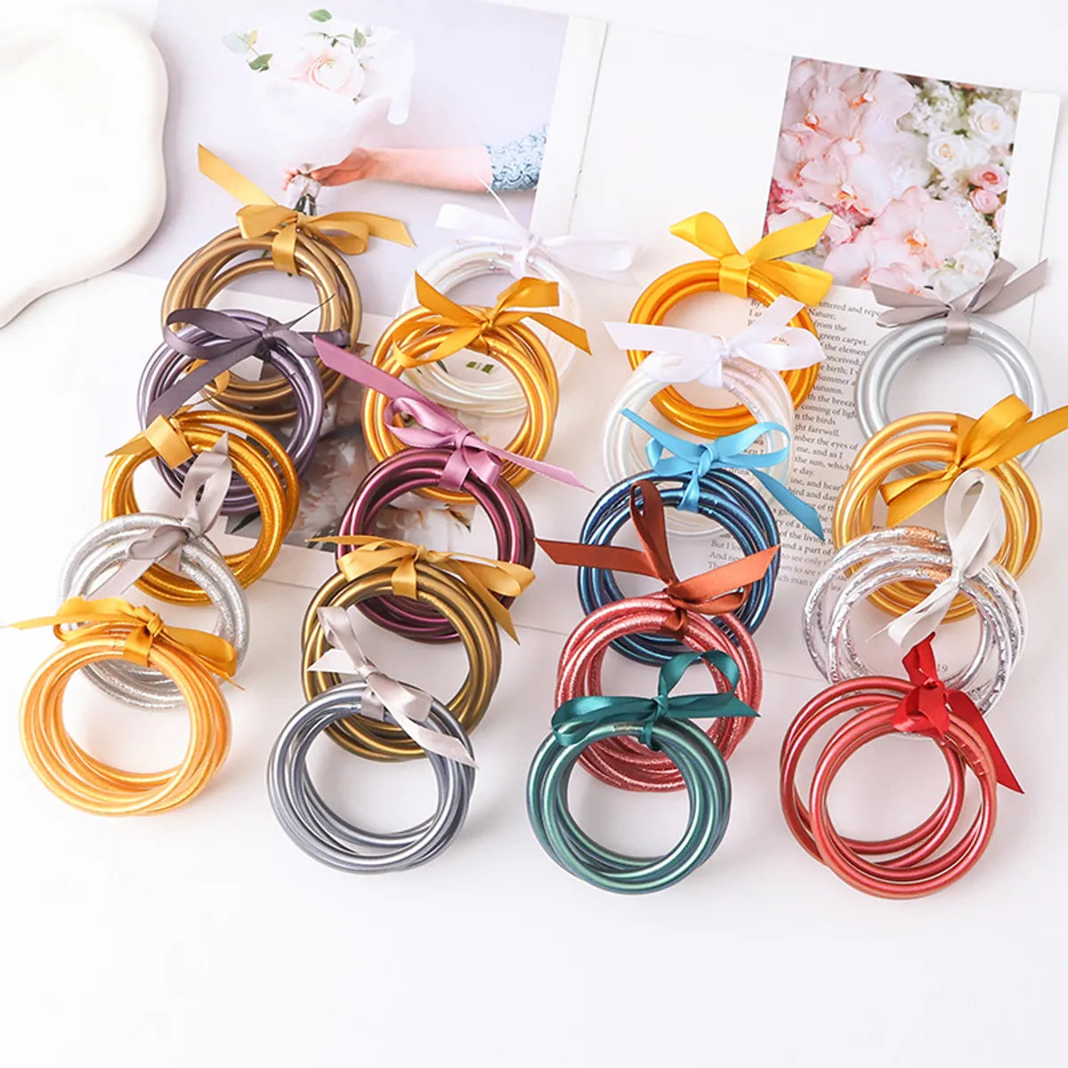 Casual Simple Style Solid Color Bow Knot Plastic Silica Gel Gold Foil Women's Wristband