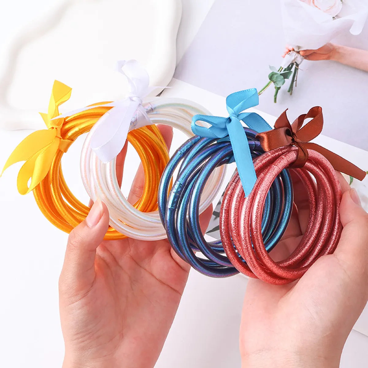 Casual Simple Style Solid Color Bow Knot Plastic Silica Gel Gold Foil Women's Wristband