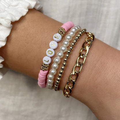 Casual Vacation Letter Artificial Pearl Alloy Soft Clay Beaded Gold Plated Women'S Bracelets