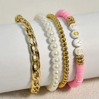 Casual Vacation Letter Artificial Pearl Alloy Soft Clay Beaded Gold Plated Women'S Bracelets