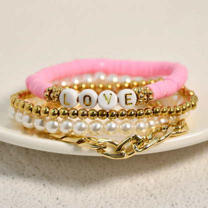 Casual Vacation Letter Artificial Pearl Alloy Soft Clay Beaded Gold Plated Women'S Bracelets