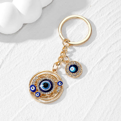 Casual Vintage Style Simple Style Devil'S Eye Heart Shape Alloy Inlay Rhinestones Bag Pendant Keychain