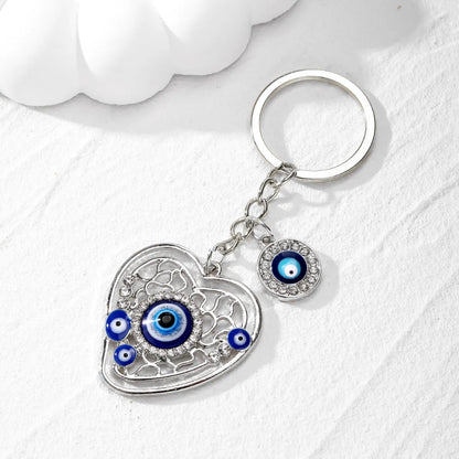 Casual Vintage Style Simple Style Devil'S Eye Heart Shape Alloy Inlay Rhinestones Bag Pendant Keychain