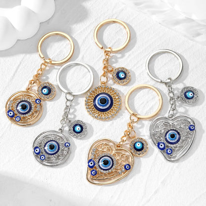 Casual Vintage Style Simple Style Devil'S Eye Heart Shape Alloy Inlay Rhinestones Bag Pendant Keychain