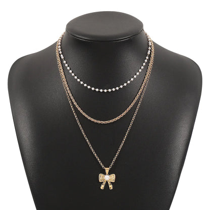 Cute French Style Bow Knot Imitation Pearl Alloy Women'S Earrings Necklace