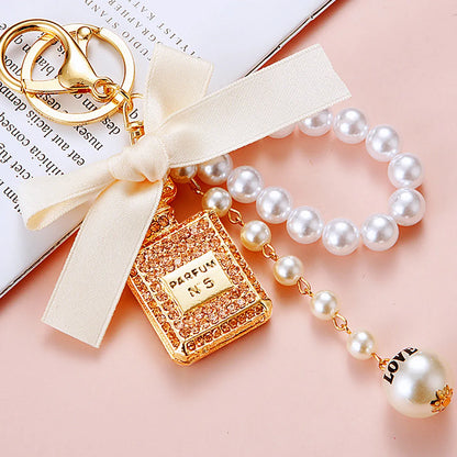 Cute Letter Bow Knot Perfume Bottle Metal Women'S Keychain