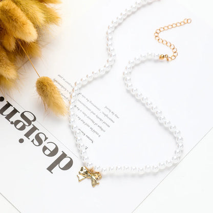 Cute Sweet Bow Knot Imitation Pearl Alloy Rope Wholesale Pendant Necklace