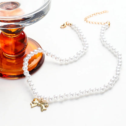 Cute Sweet Bow Knot Imitation Pearl Alloy Rope Wholesale Pendant Necklace