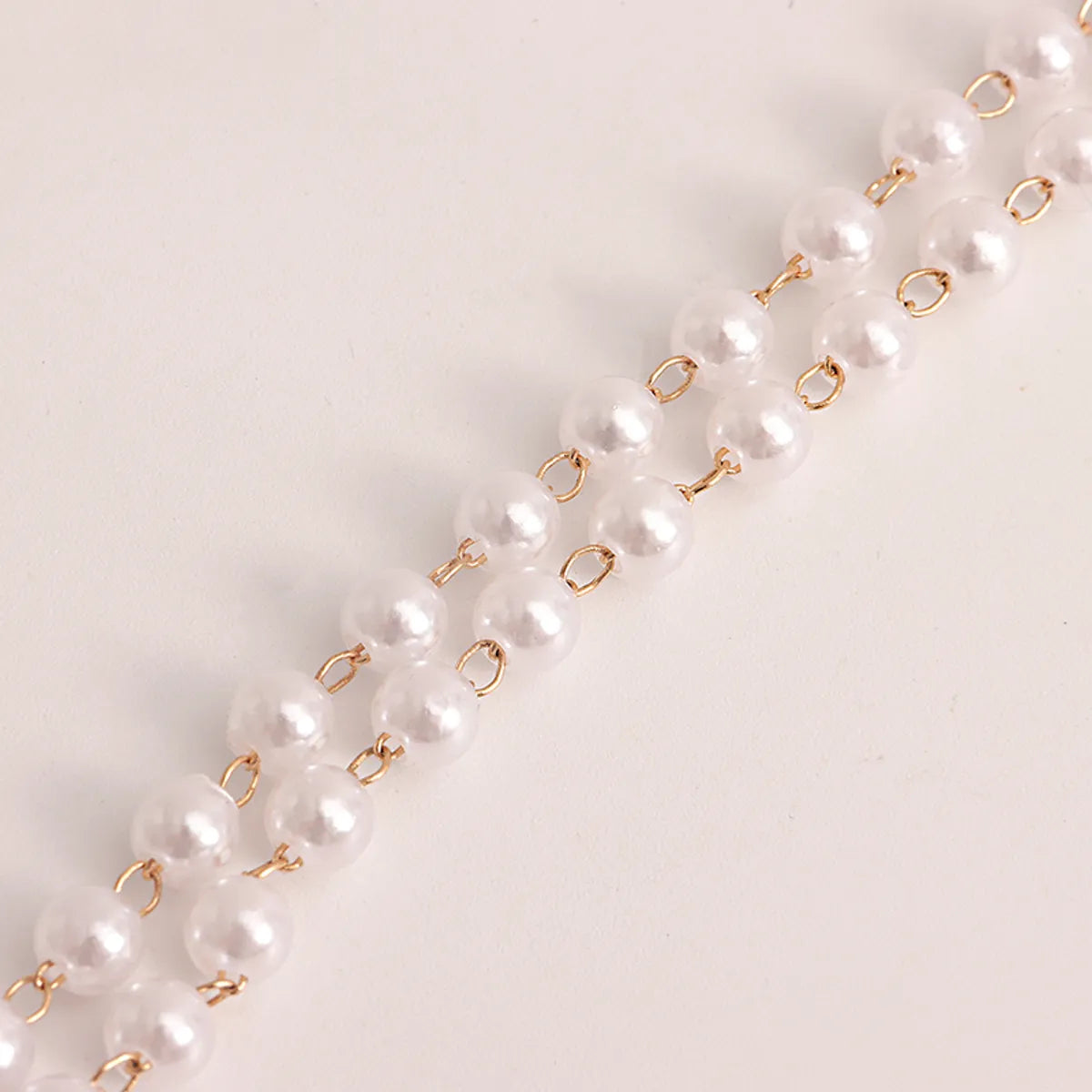 Elegant Geometric Solid Color Arylic Imitation Pearl Inlay Pearl Gold Plated Women's Waist Chain