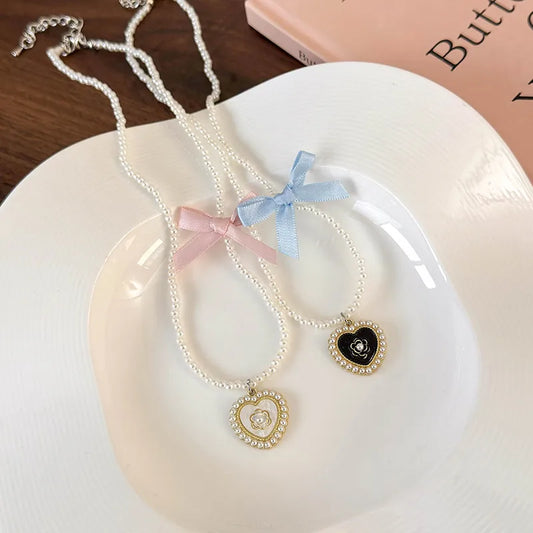 Elegant Glam Sweet Heart Shape Flower Bow Knot Imitation Pearl Alloy Beaded Inlay Rhinestones Pearl Women'S Pendant Necklace