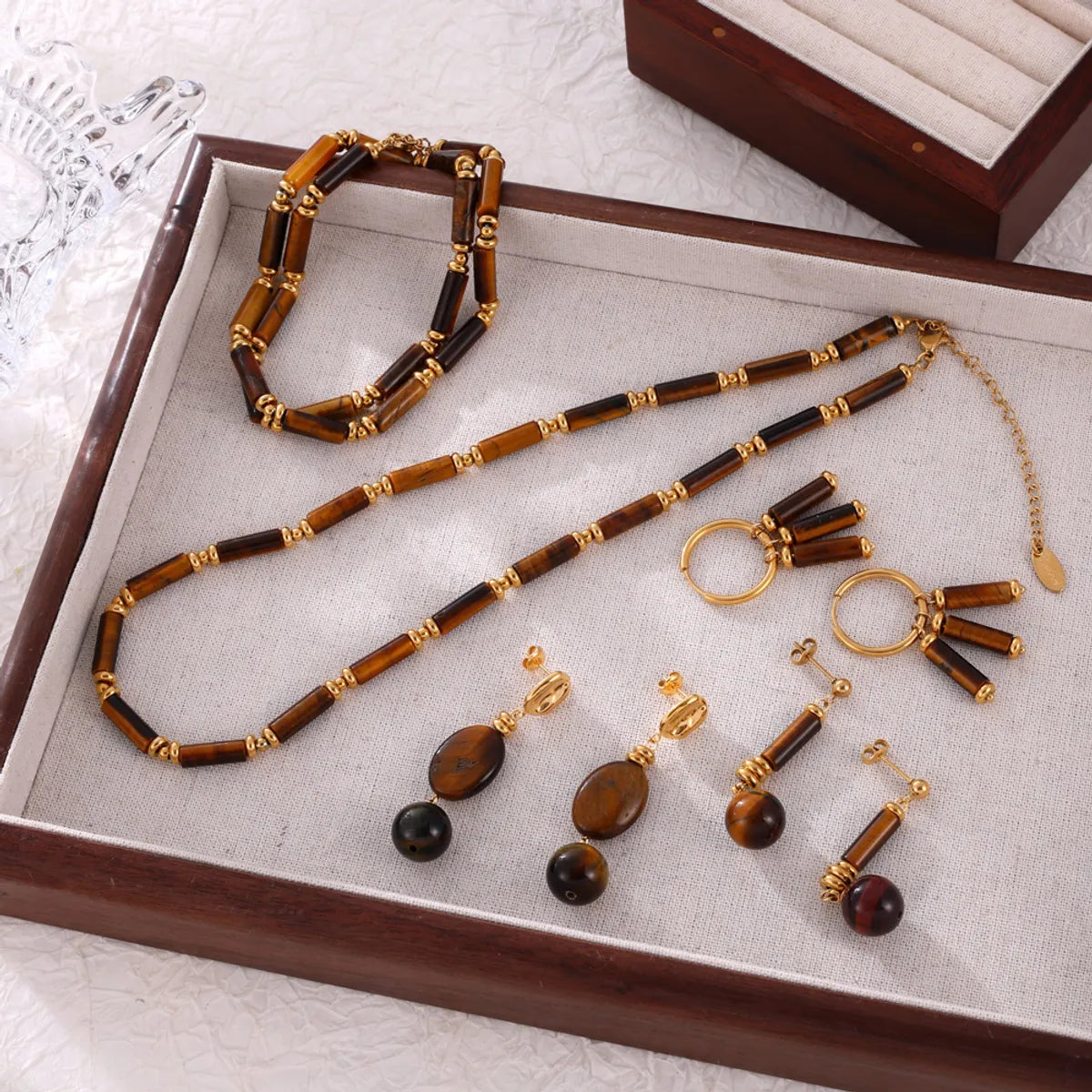 Elegant Retro Lady Round Oval Lines Tiger Eye Titanium Steel Beaded Plating Women'S Earrings Necklace