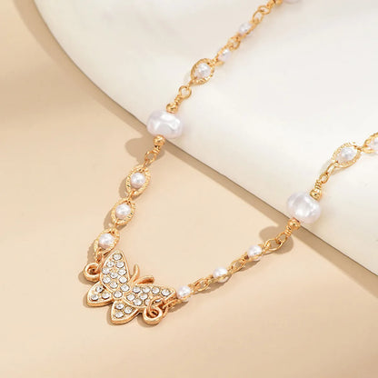 Elegant Simple Style Butterfly Alloy Plating Inlay Artificial Pearls Rhinestones Women's Choker