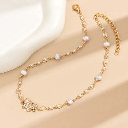 Elegant Simple Style Butterfly Alloy Plating Inlay Artificial Pearls Rhinestones Women's Choker